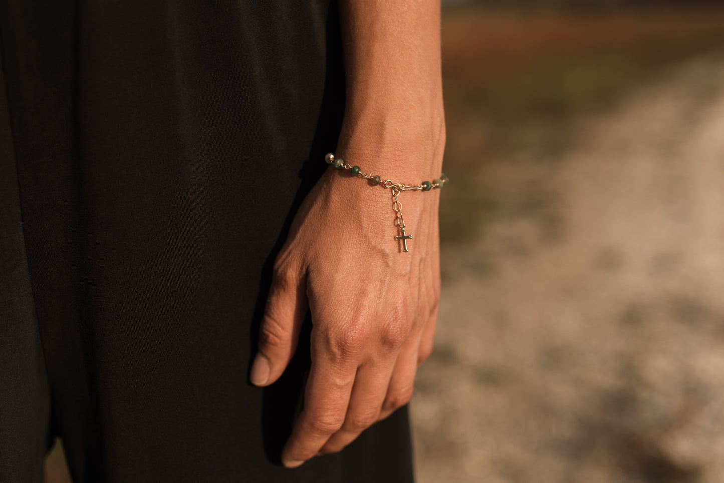 Emerald cross charm bracelet