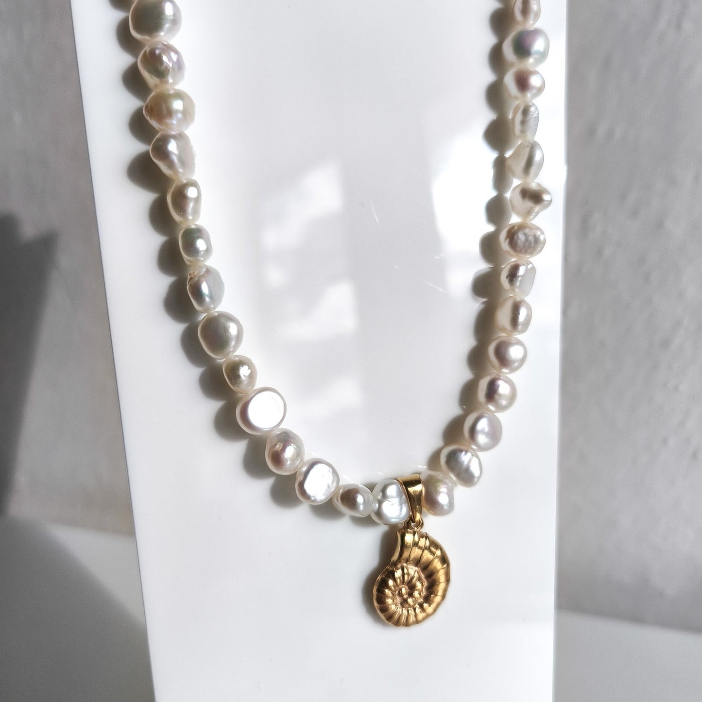 Gold seashell necklace