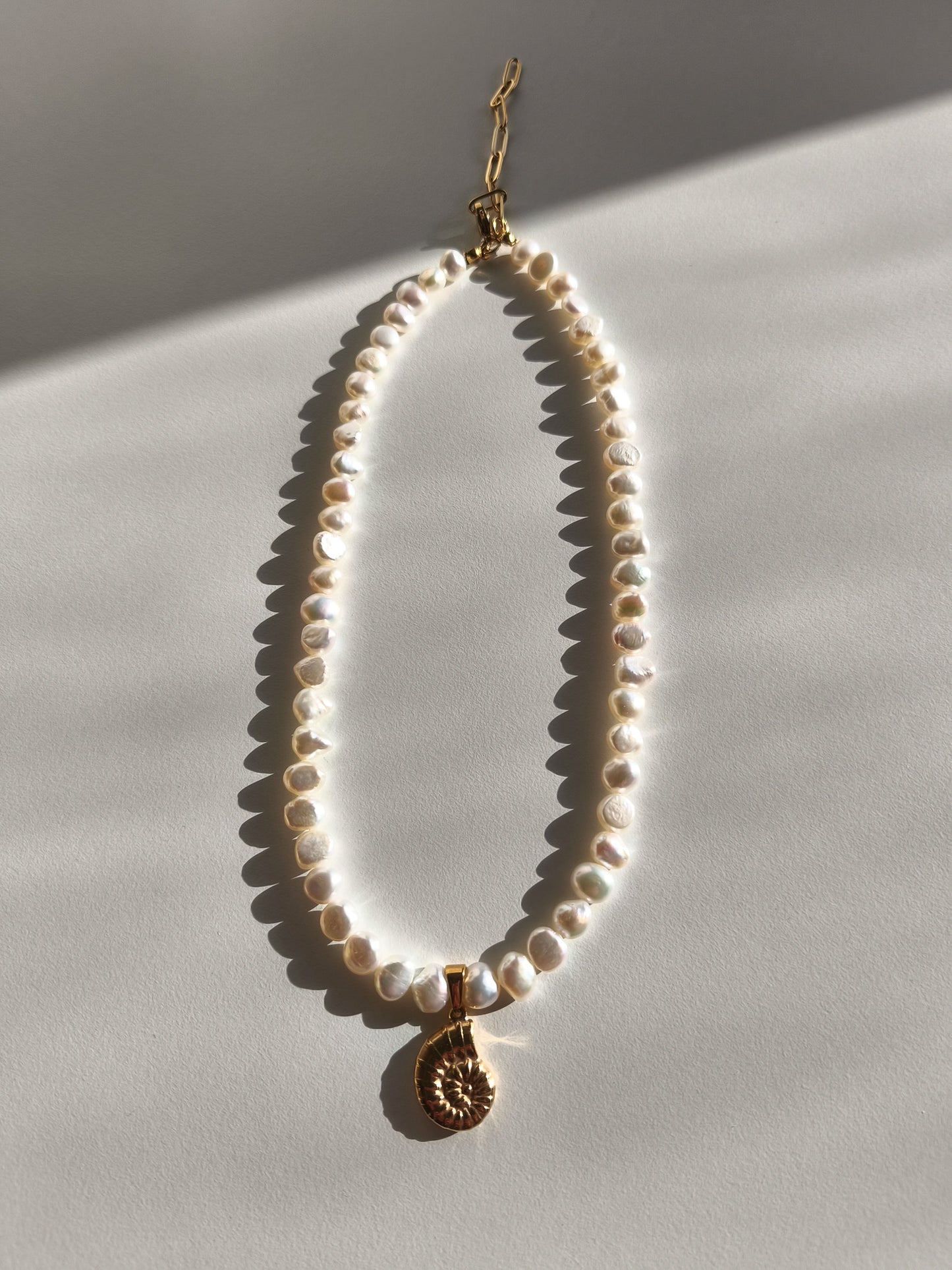 Gold seashell necklace