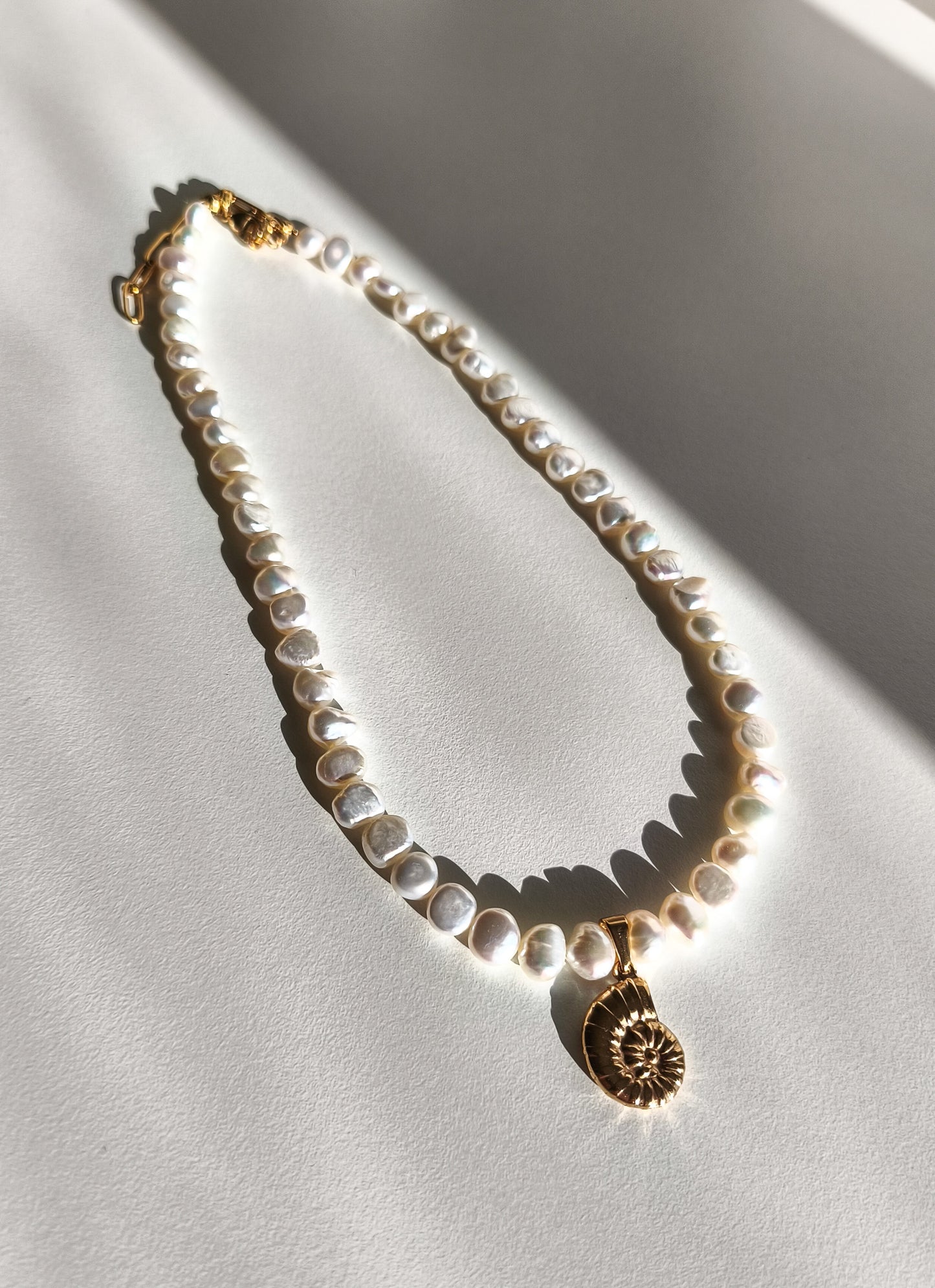Gold seashell necklace