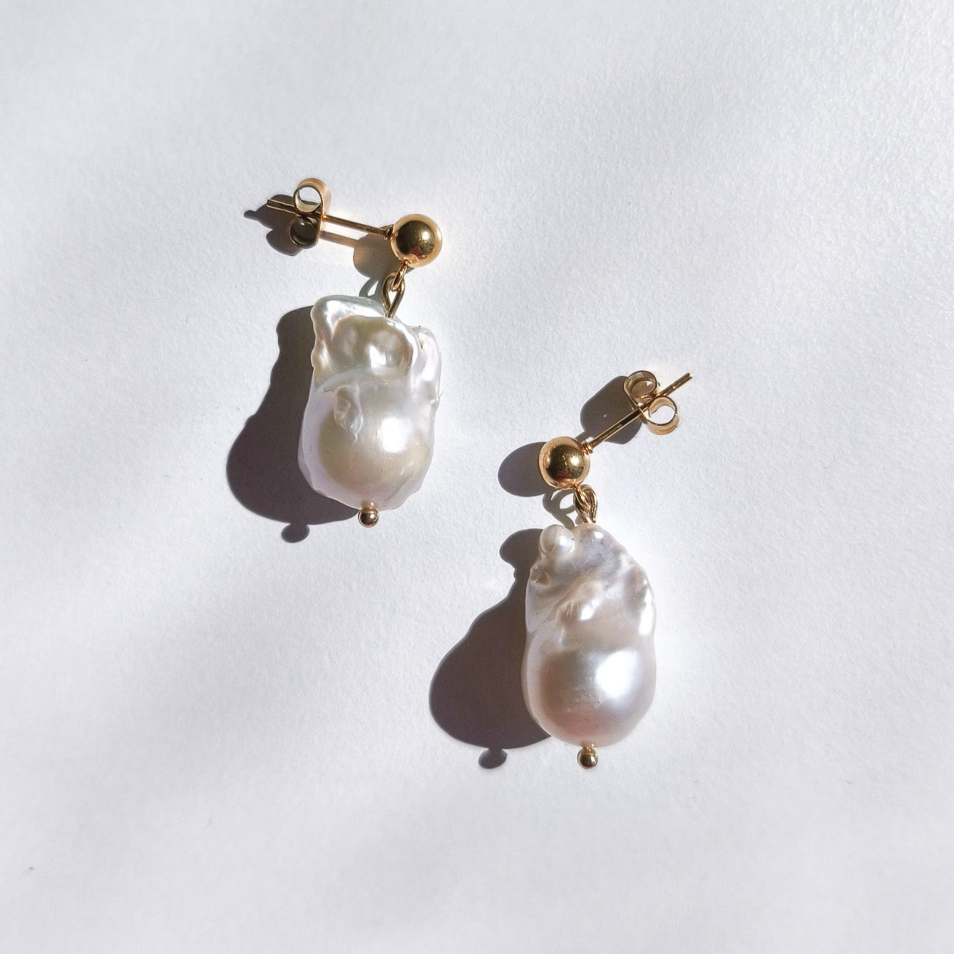 Flameball pearl drop earrings