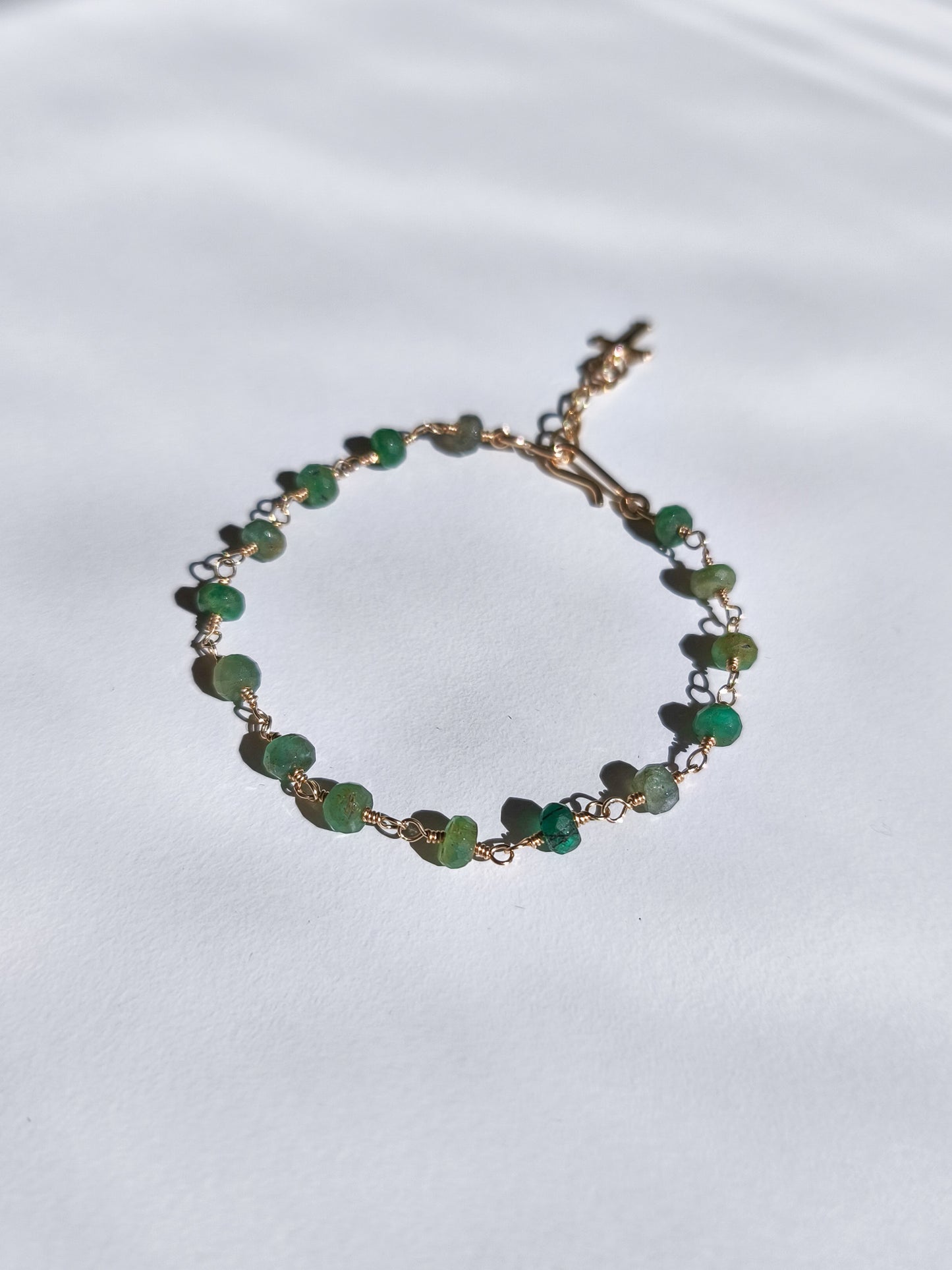 Emerald cross charm bracelet