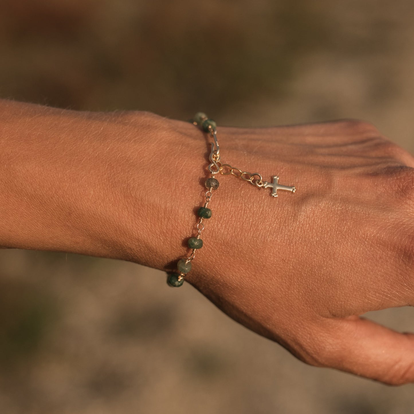 Emerald cross charm bracelet